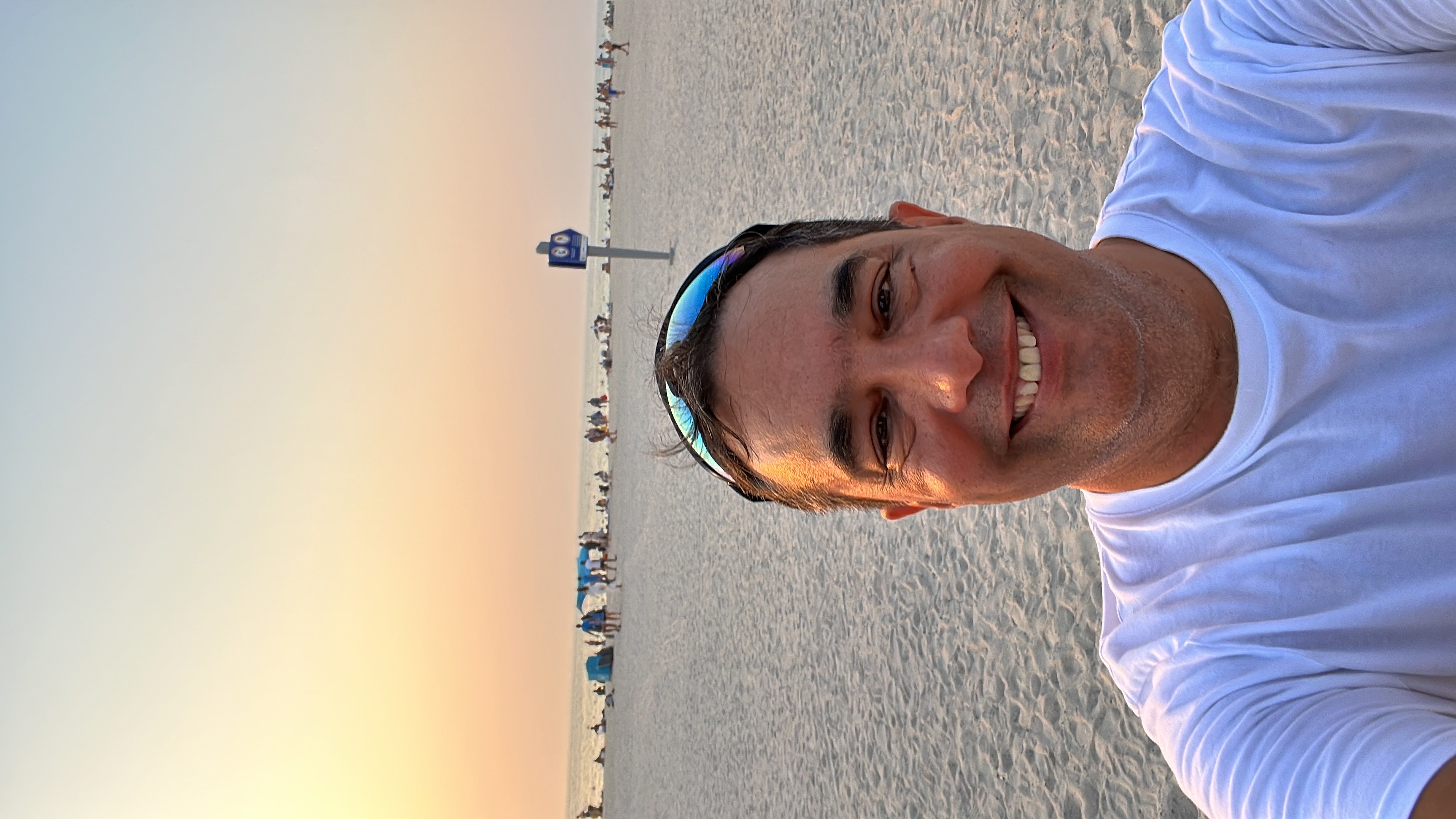 Patrick, the founder of Where Does My Money Go, on a beach at sunset.